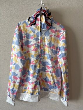 White hoodie with multi color pastel camo design